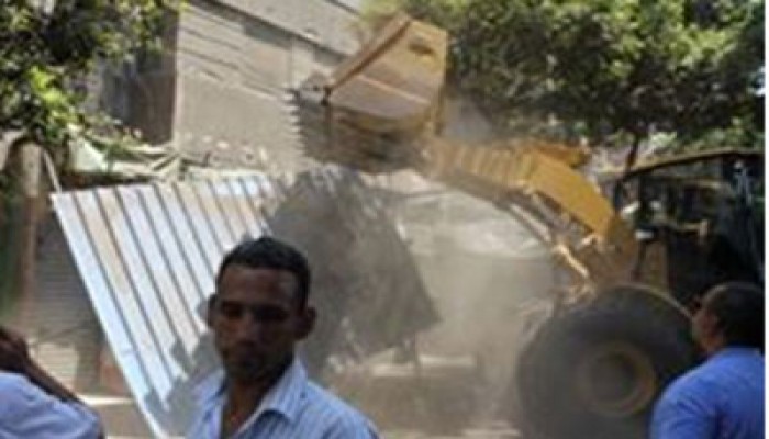 الباعة الجائلون لـ"لشرطة": يحيا مرسي.. وهنشجع الإخوان