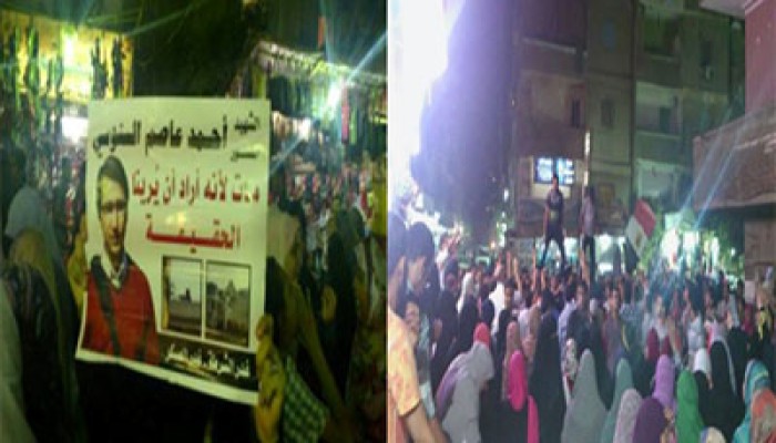 ثوار المعادي يرفعون صورة أحمد عاصم شهيد مذبحة الساجدين