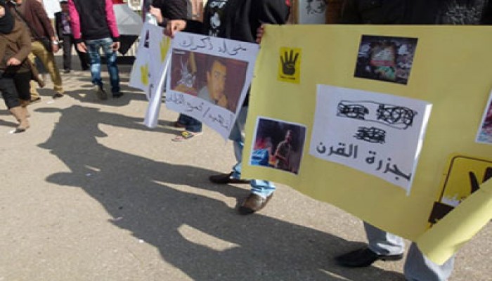 معرض مصور لمحرقة القرن ووقفة صامتة لطلاب حقوق السادات