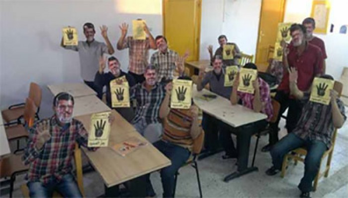 بالصور.. وقفة لطلاب "الأكاديمية العربية" بأسوان تحيةً لصمود "حرائر الإسكندرية"