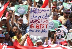 "أقباط المهجر" فرحين بالانقلاب العسكري على الرئيس مرسي