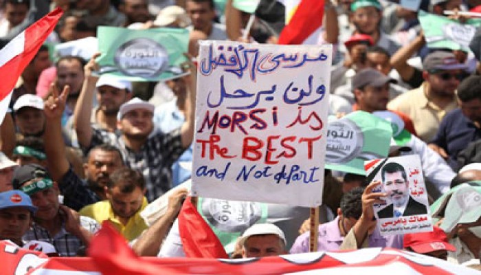 "أقباط المهجر" فرحين بالانقلاب العسكري على الرئيس مرسي