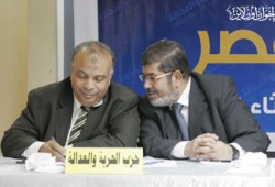 د. مرسي يهنئ الكتاتني برئاسة مجلس الشعب